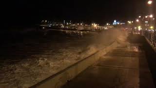 Rough seas breaking against the sea wall at Porthcawl Promenade [upl. by Kling369]