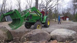 John Deere 3038e  Grapple  Building a Rock Wall [upl. by Slotnick]