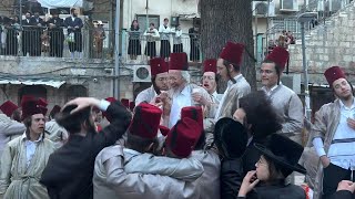 UltraOrthodox Jews celebrate Purim holiday in Jerusalem  AFP [upl. by Ardiedal666]