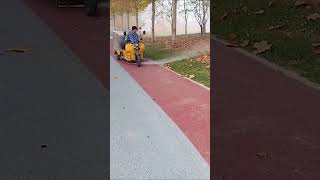 The process of clearing fallen leaves on sidewalks with high pressure water guns [upl. by Brittni]