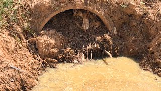 Clog Clogged Culvert Drain Releasing And Cleaning Debris Stuck In Drains [upl. by Eiser]