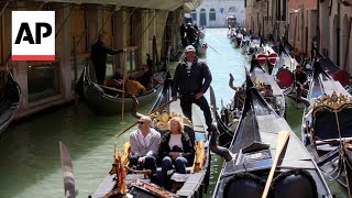 Venice launches experiment to charge daytrippers  AP Explains [upl. by Byram739]