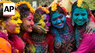 Holi festival celebrated with bursts of color across India [upl. by Cardon]