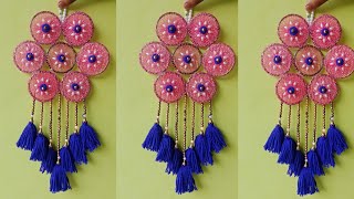 how to make woolen flower wall hangingold bangles wall hanging craft ideas for woolen।। [upl. by Sinnylg]