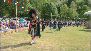 Drum Major leading massed bands playing Glendaruel Highlanders at 2023 Drumtochty Highland Games [upl. by Ardnasal]