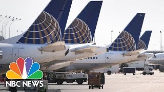 Man Dragged Off Overbooked Flight After Refusing To Give Up Seat  NBC News [upl. by Arvell]