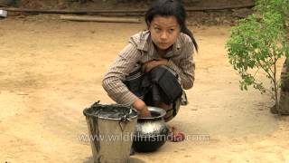 Manipuri woman swabs floor with cow dung [upl. by Yelsgnik]