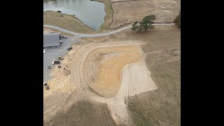 Spreading topsoil on dam [upl. by Innep]