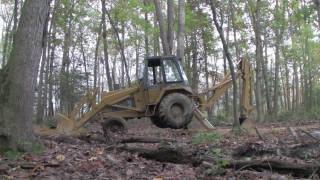 CASE 580C BACKHOE  How to get a backhoe unstuck in the mud HD [upl. by Ainatnas913]