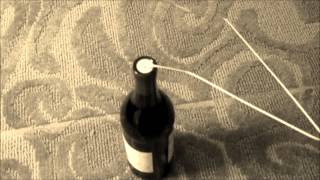 How to open a wine bottle with no corkscrew  but maybe just a coat hanger [upl. by Gaynor]