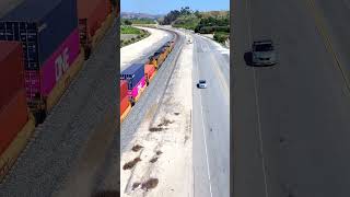 After getting Helpers an Eastbound Intermodal heads up the hill through San Timoteo Canyon [upl. by Letsirk]