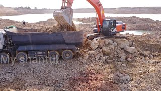 Stonework of excavator cat Hitachi 350 and dump truck [upl. by Trudnak]