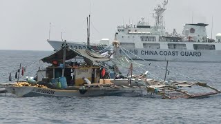 Chinese vessels shadow Philippine civilian convoy sailing towards disputed reef  AFP [upl. by Almita]