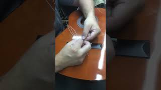 How to Restring a ClassicalNylon String Guitar Luthier Video  jbrownmusicandrepairscom [upl. by Lemon629]