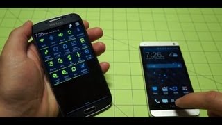 Galaxy S 4 vs HTC One  Pocketnow [upl. by Aliekat]