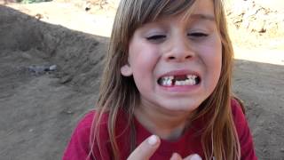 Little girl pulls out her own tooth [upl. by Ycnalc]