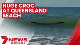 Crocodile spotted swimming at Central Queensland beach  7NEWS [upl. by Emoraj]