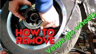 How to remove Vespa gts 300 hpe rear wheel and front wheel Vespa gts 300 hpe rear wheel removal [upl. by Rehpetsirhc539]