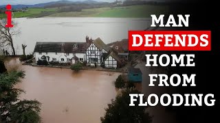 Man DEFENDS Home From Being Engulfed In Flood Waters With Self Made Barriers [upl. by Felder]