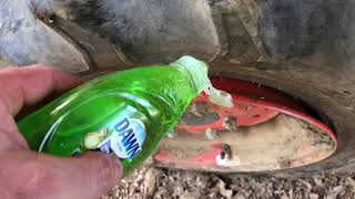 Easy trick to get a tractor tire back on the rim [upl. by Nanyt51]