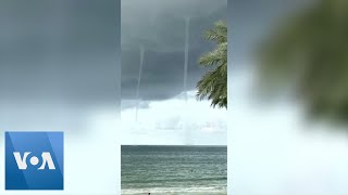 Multiple Waterspouts Rise Near Florida Beach [upl. by Yrevi]