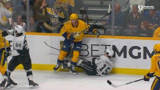 Jeremy Lauzon lays a crushing hit on Alex Turcotte along the boards [upl. by Basile]