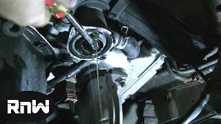 How to Replace a Thermostat on a 97 Subaru Outback 25L Engine [upl. by Ettigirb]