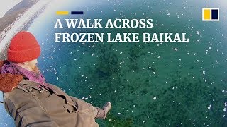 Russian man films thrilling walk across frozen ice on world’s deepest lake [upl. by Daahsar31]