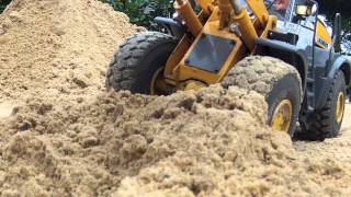 Construction of a water retention area with RC Wheelloader and Excavator [upl. by Snashall]