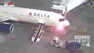 Stunning video shows Delta plane bursting into flames after landing [upl. by Refinej]