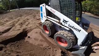 spreading topsoil in the bobcat [upl. by Lan]