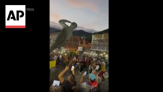 WATCH Protesters take down statues of Hugo Chavez in Venezuela [upl. by Kenward]