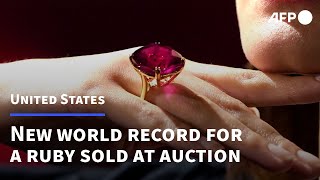 Ruby gemstone sells for record 348 million  AFP [upl. by Arenahs497]