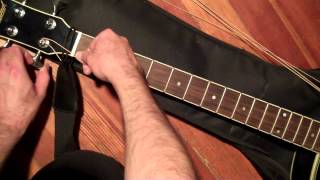 How To Put New Strings On An Acoustic Bass Guitar And Tune It [upl. by Rosita476]