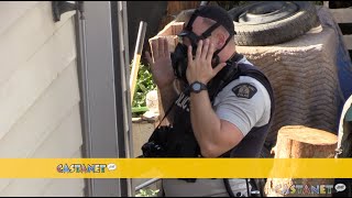 Tactical police leave Lake Country home after raid crews enter with gas masks [upl. by Docilla435]