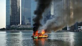 Boat on fire in Marina Bay [upl. by Arriaet]