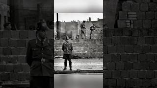 A West Berlin policeman guards East German soldiers behind him as they build Berlin in 1961 [upl. by Notlimah725]