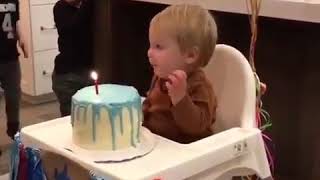 Kid grabs lighted birthday candle [upl. by Elocal]