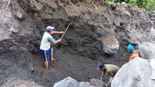 Hard Work miners dig and knock out black sand on the cliffs [upl. by Cock]