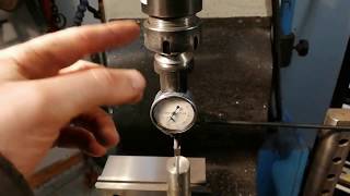 Use of coaxial indicator to find center of a rod in order to drill and ream [upl. by Nichy]