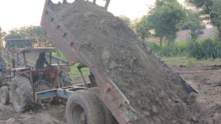 Efficiently Unloading a Work Tractor from a Trailer [upl. by Annawahs]