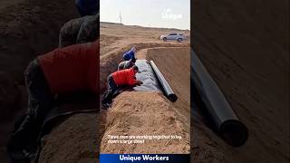 Plastic sheeting being laid down desert  The workers do their job perfectly  machine shorts [upl. by Atnauqal]