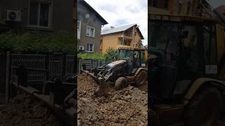 CAT Backhoe strong pushing uphill [upl. by Ainnek]