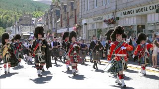 Drum Majors lead the combined Pipe Bands over river Dee marching to 2022 Ballater Highland Games [upl. by Darrow]