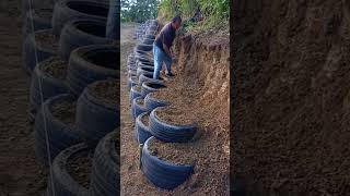 Slope protection building process with tires [upl. by Ferrell]