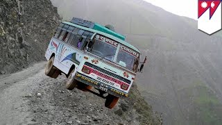 Nepal bus crash Overcrowded bus plunges hundreds of feet down steep hill killing 30  TomoNews [upl. by Enahsed988]