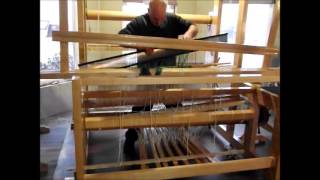 Using the reed to spread warp threads for loom weaving [upl. by Gretel]