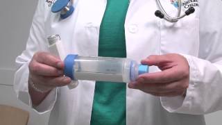 Asthma howto How to use an inhaler with a spacer and mouthpiece [upl. by Ahsikahs]