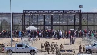 Migrants rush the Texas border in El Paso [upl. by Akimahc]