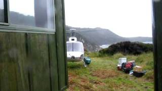 Helicopter taking off from Long Harry Hut on Stewart Island New Zealand [upl. by Milty467]